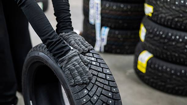 istock Mechanic keeps new studded car tires in garage. 2200934932