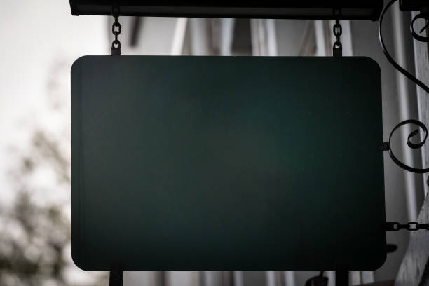 istock An empty horizontal green rectangular sign hanging on the exterior of a Dutch shop in the Netherlands. The bold color and minimalist look draw attention, offering ample space for custom content. 2200938174