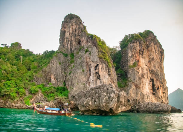istock Long-tail boats silhouetted against a stunning sunset at Nui Beach, Phi Phi Don 2200945089