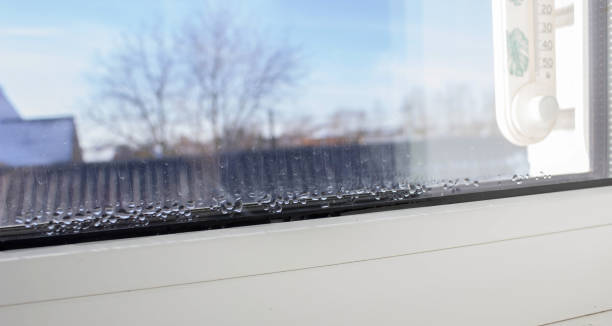 istock Close-up of condensation on a PVC window, white plastic window, humidity concept. 2200953366