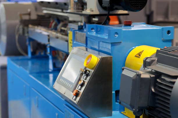 Close up of automated plastic extruder machine. Selective focus.