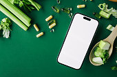 smartphone-with-blank-screen-among-celery-cucumber-lemon-capsules-and-wooden-spoon-on-a-green.jpg?b=1&s=170x170&k=20&c=N9oYzaHCbuw5hDDYo86Hsj0gQMBNhNzu0sIPm2IUrxQ=