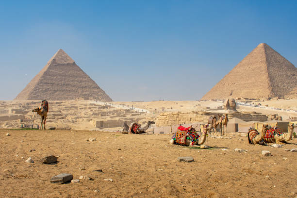 istock Famous Great Pyramids of Chephren and Cheops, Cairo, Egypt. Giza pyramid complex (Giza Necropolis). View of pyramids from the Giza Plateau 2200954552
