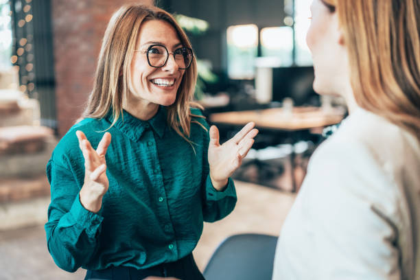 istock Business women in friendly conversation 2200954698