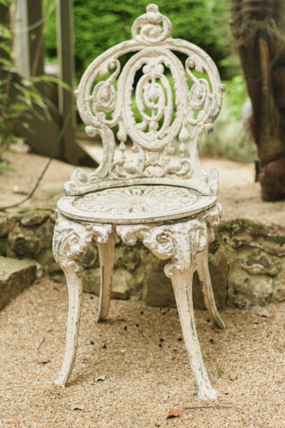istock White patterned vintage antique wrought iron chair 2200958088