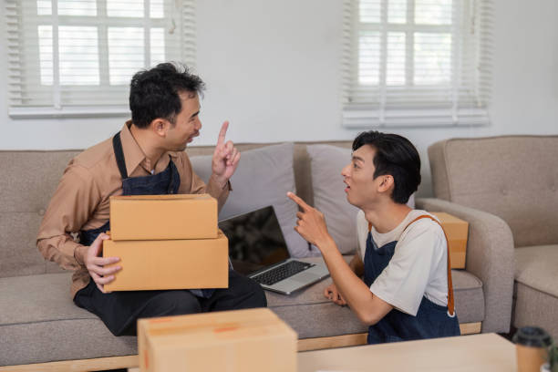 istock Dynamic conversation between online sellers about product packaging and logistics at home. 2200962183
