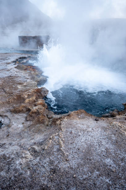 istock Geothermal Hot Spring Geyser Erupting in Rugged Landscape 2200965099