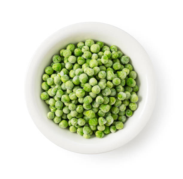 istock Frozen Green Peas in a Bowl on a White Background, Viewed from Above 2200966300