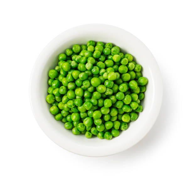 istock Boiled Green Peas in a Bowl on a White Background, Viewed from Above 2200966312