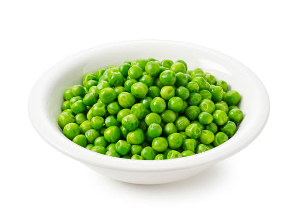 istock Boiled Green Peas in a Bowl on a White Background 2200966317