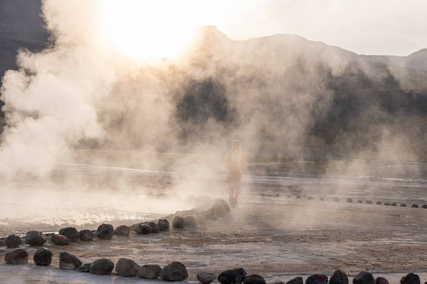 istock Person Walking Through Smoky Geothermal Landscape 2200966566