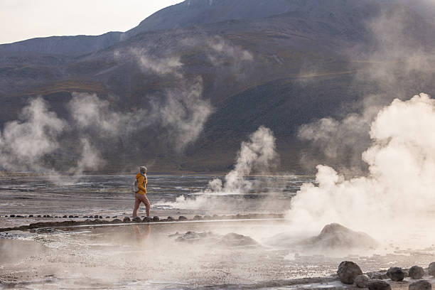 istock Person Walking Through Smoky Geothermal Landscape 2200966567
