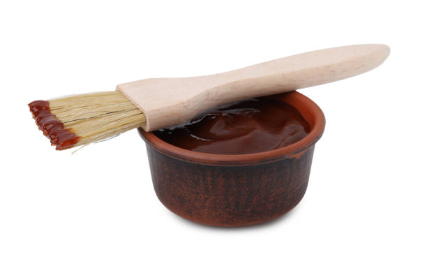 istock Marinade in bowl and basting brush isolated on white 2200966998