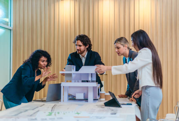istock Architecture Team Discussing Sustainable Building Design 2200972698