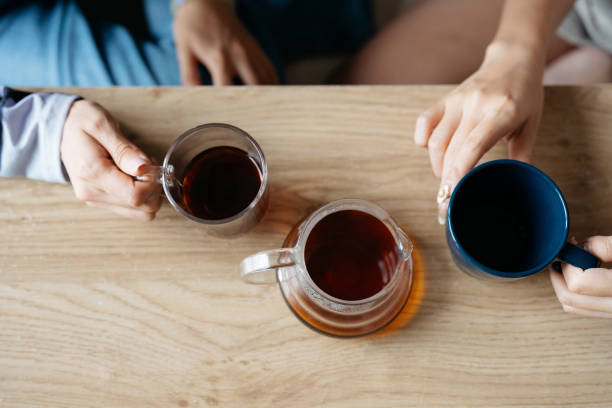 istock Asian woman enjoying coffee together 2200972904