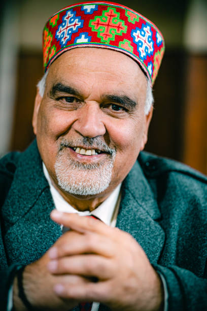 istock Happy elderly gentleman in traditional colorful Himachali cap. 2200978241