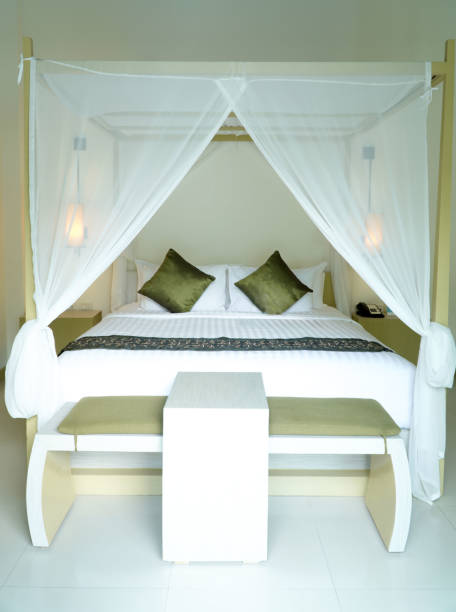 istock Interior of a hotel bedroom, double bed with green pillows 2200978578