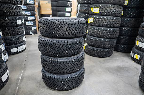 istock New car studded tires in the store. 2200980227