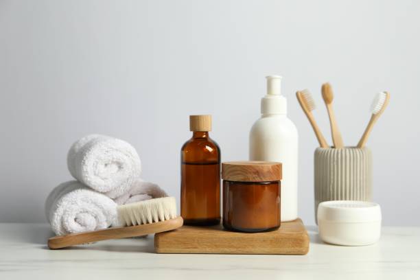 istock Different bath accessories and personal care products on light marble table against white wall 2200986530