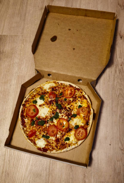 istock Enjoy a Delicious and Homemade Pizza Served in a Convenient Takeout Box for Your Meal 2200988607