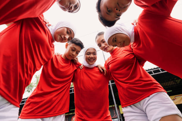 istock Diverse Women’s Football Team Huddle Before the Game 2200988952