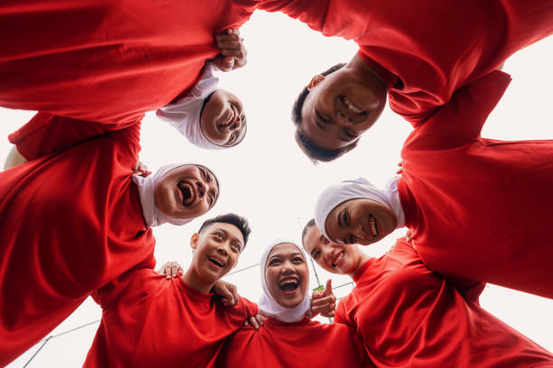 istock Cheerful Diverse Women’s Football Team Huddle Before the Game 2200989047