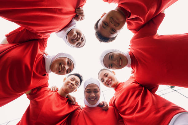 istock Cheerful Diverse Women’s Football Team Huddle Before the Game 2200989132