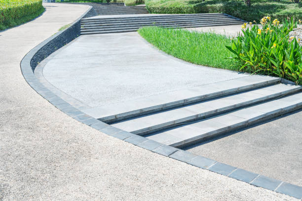 istock Curved pathway and stairs through the lush green park 2200989279