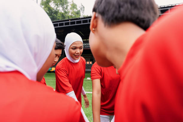 istock Diverse Women’s Football Team Huddle Before the Game 2200989351