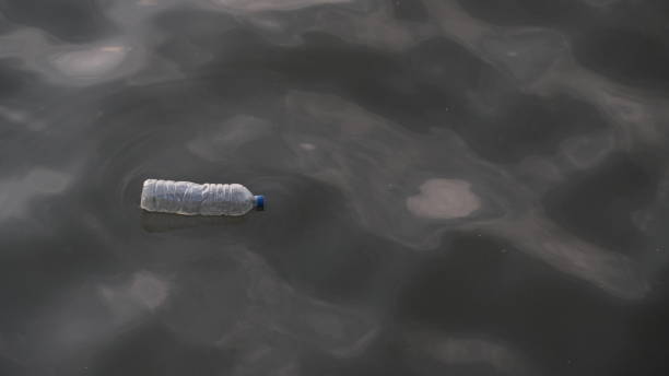 istock Plastic bottle waste floating in seawater. 2200990580