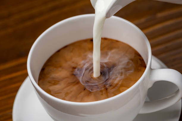 istock Pouring milk into a cup of coffee 2200991467