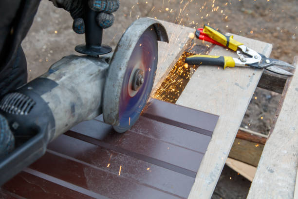 istock A man is using a power tool to cut a piece of wood 2200992881