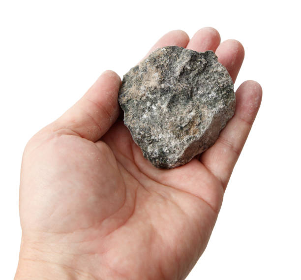 istock Jadeite stone in hand isolated on white background 2200993042