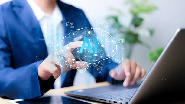 istock Chat with AI or Artificial Intelligence. Young businessman chatting with a smart AI or artificial intelligence using an artificial intelligence chatbot developed by OpenAI. 2200995631