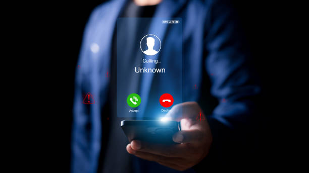 istock Unknown number displayed showing on smart mobile phone. Human use smartphone with incoming call from unknown number, spam, hacker, call center, crime, 2200995671