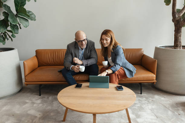 istock Business colleagues sharing ideas in stylish office 2200997171