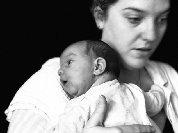 istock Mother holding her Just born Baby. 2200997413