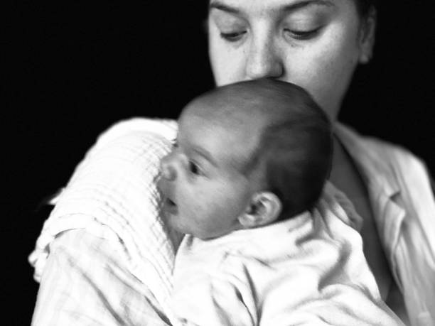 istock Mother holding her Just born Baby. 2200997414