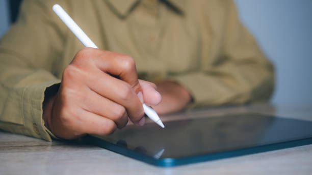 istock Businessman using digital tablet on touch screen. Technology and social networking concept. copy space. 2200998323