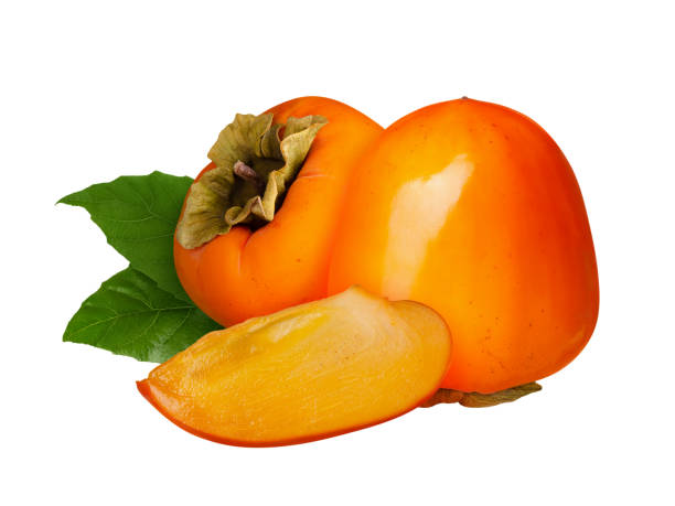 istock Ripe persimmon fruit with slice and green leaves isolated on white background 2200999605
