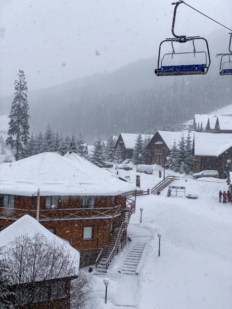 istock Snowy Mountain Village with Ski Lift 2201001897