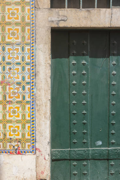 istock colorful ceramic tiles next to a door in downtown Lisbon 2201002450