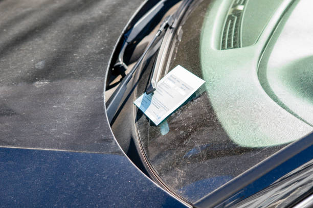 istock Speeding ticket on a windshield for illegal parking in the city 2201002780