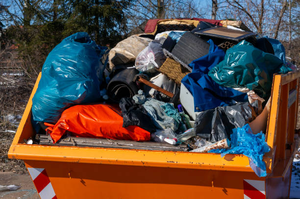 istock orange container with garbage Waste separation at the recycling center 2201002802