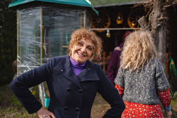istock Smiling mature woman outdoors 2201002864