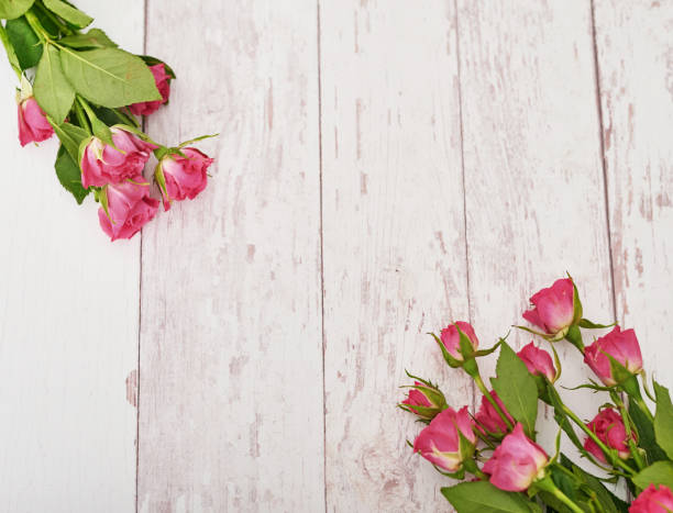 istock Mother's Day greeting card. Pink flowers on and cake. Easter spring  flovers 2201002893