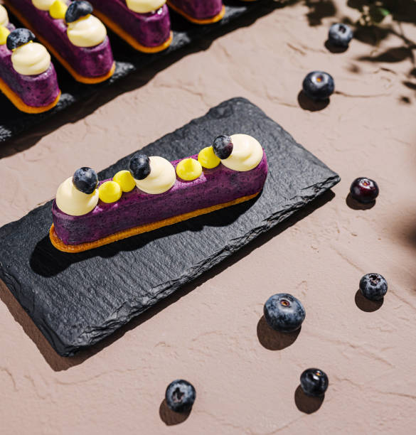 istock Delightful dessert display featuring blueberry tart on slate 2201008215