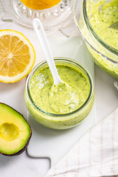 istock Homemade avocado yogurt dressing with ingredients on kitchen table 2201010641