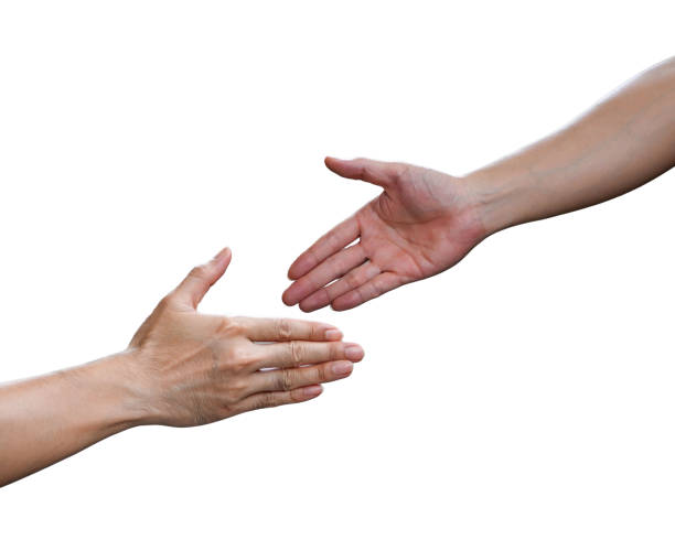 istock two hands reaching for each other isolated on white background 2201012186