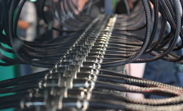 Braided cables inserted in device for testing battery cells of electric vehicles at special workshop